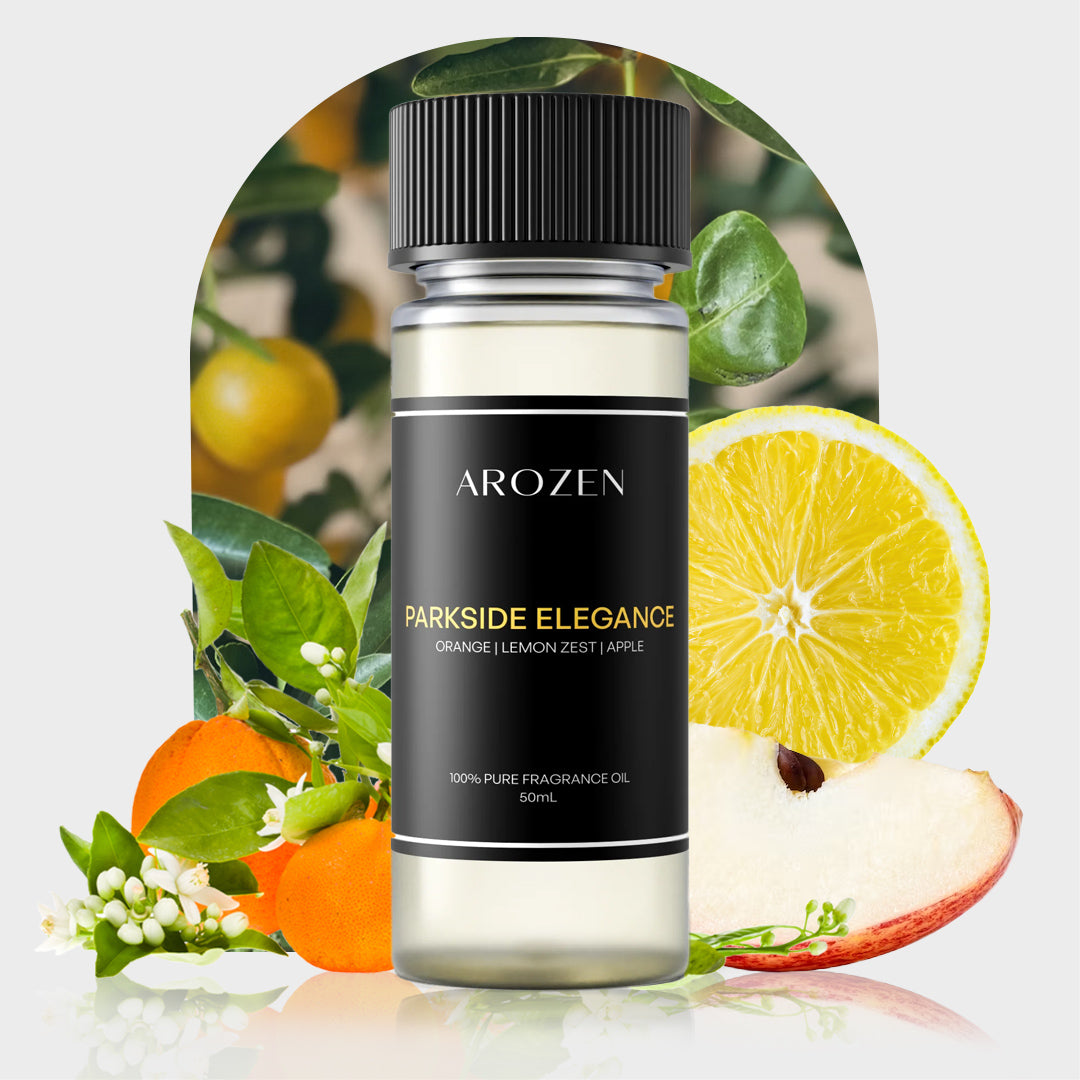 
                  
                    A bottle of Arozen Parkside Elegance fragrance oil is surrounded by fresh oranges, lemon, lemon blossoms, green leaves, and a red apple slice, indicating the scents citrus and fruity notes.
                  
                