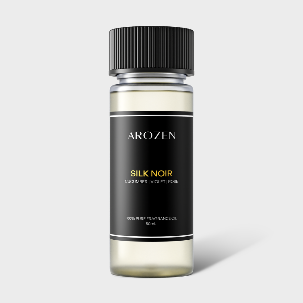 
                  
                    A clear bottle with a black cap labeled SILK NOIR features notes of Cucumber, Violet, and Rose. This 50ml pure fragrance oil is designed for electric scent diffusers, offering a Hilton Hotels-inspired aroma experience.
                  
                